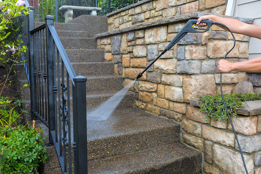 man cleaning the outdoor stairs