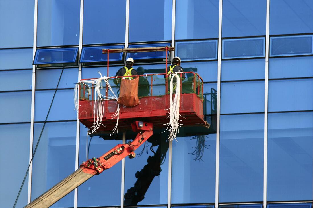 workers cleaning the window