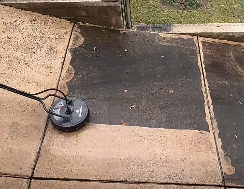 cleaning the concrete brick walkway